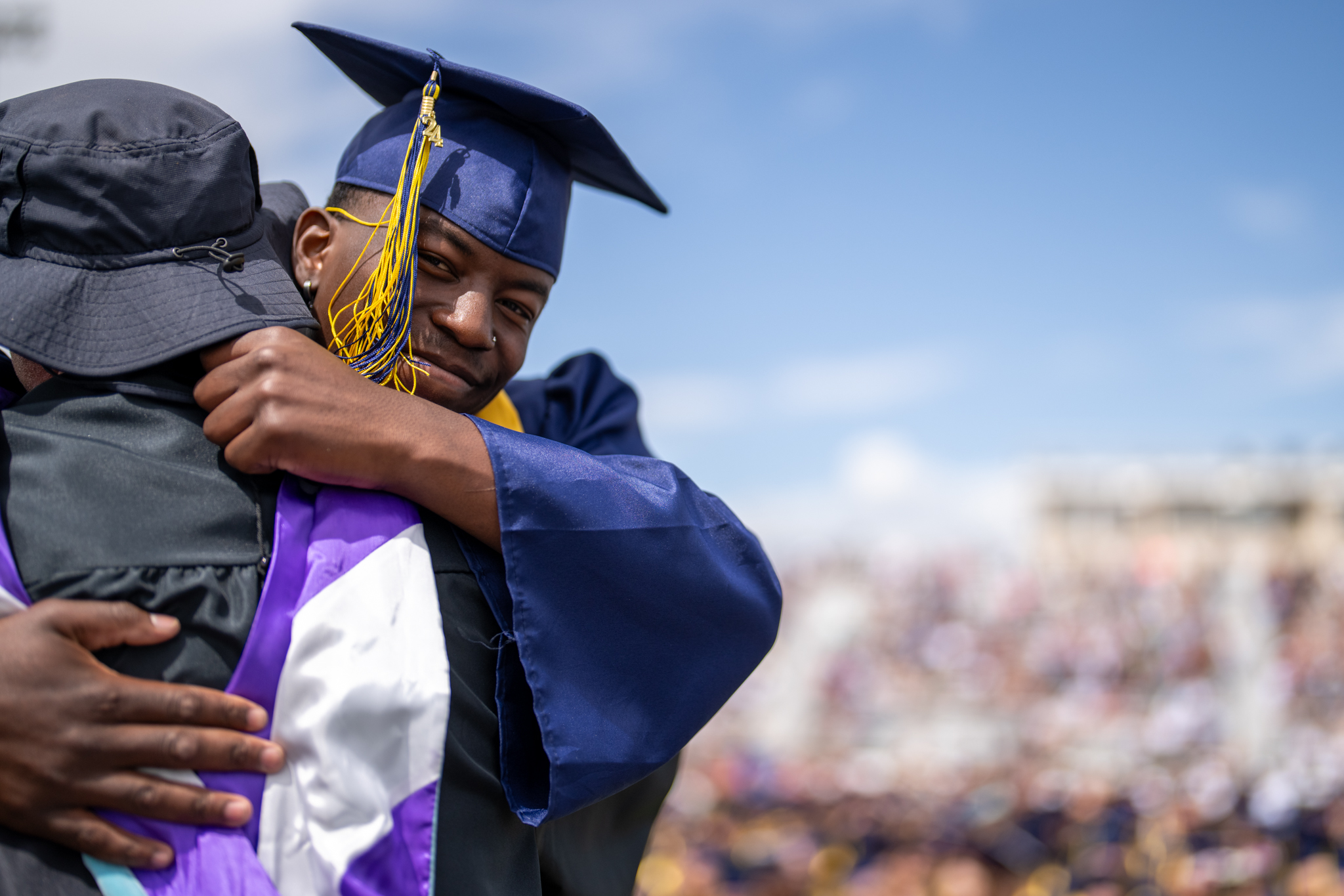 Graduating Frederick High student hugs teacher.